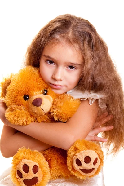 Маленька дівчинка і плюшевий ведмідь — стокове фото