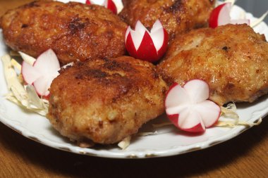 Meat rissoles with garden radish clipart