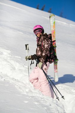 Girl climbing for a freeride clipart