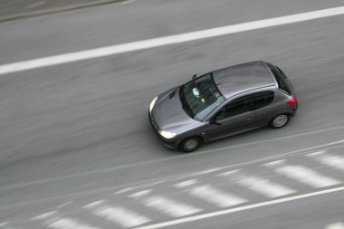 Fast moving car on road clipart