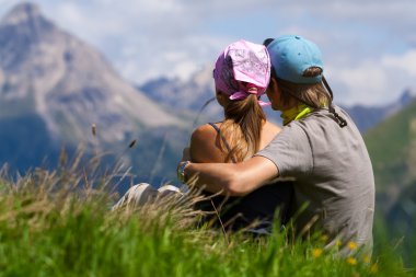 Couple enjoying a mountains view clipart