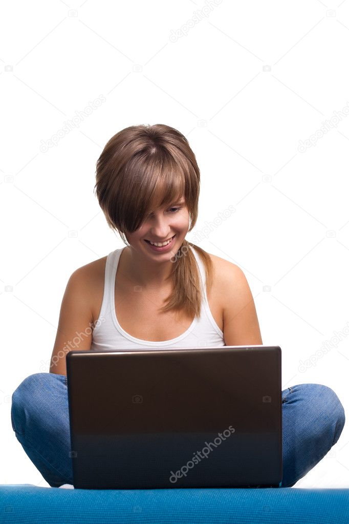 Young girl smiling with laptop