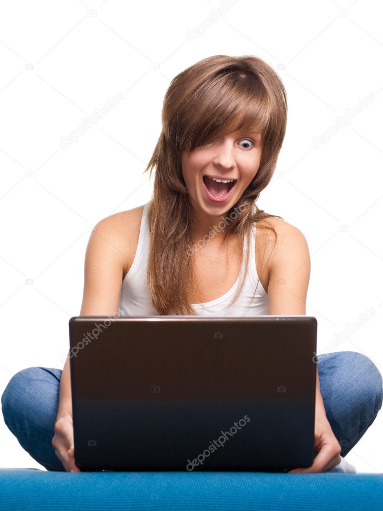 Young girl surprised with laptop
