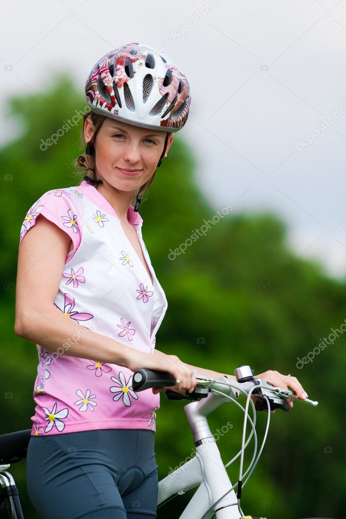 Smiling pretty girl - cyclist
