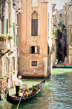 Gondola on a canal of Venice. Italy clipart