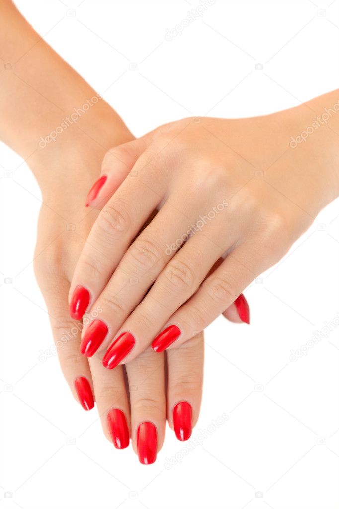 Hands of a young women. Red nail polish