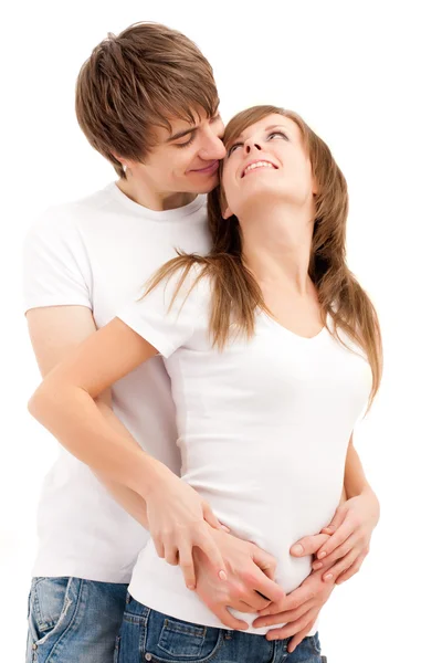 Unga lyckliga paret krama vita leenden — Stockfoto
