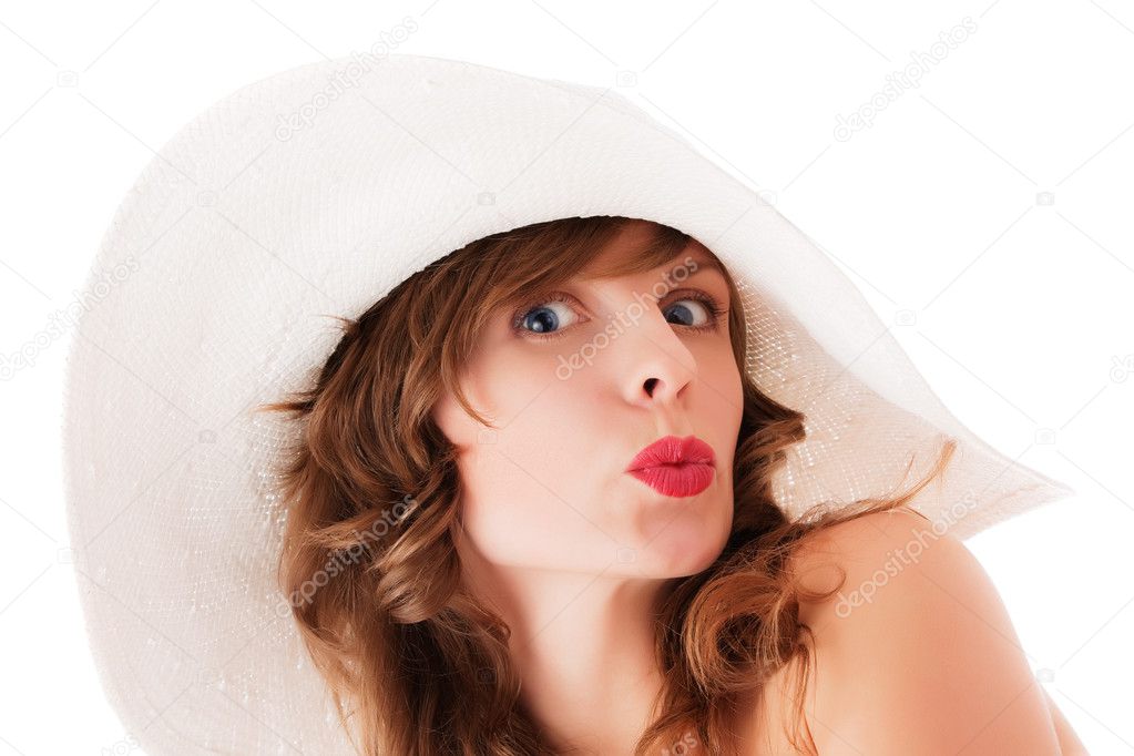 Young woman in white summer hat kissing