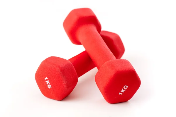 Stock image Two red dumbbells on white background