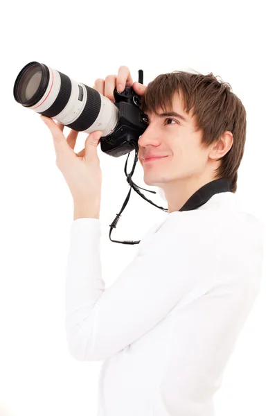 Photographer in white holding phone came Stock Photo