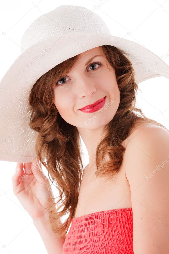 Romantic young woman in white straw hat