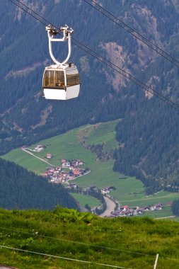 Cable car high in the mountains clipart