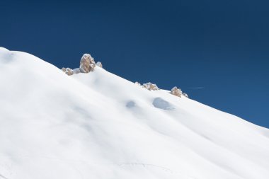 Snow covered hill and sky clipart