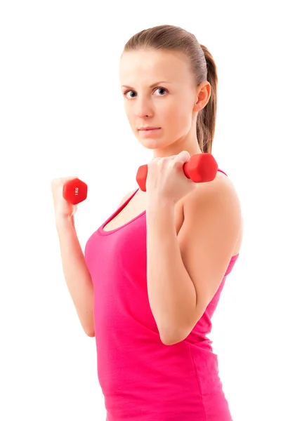 Young fit woman lifting dumbbells — Stock Photo, Image