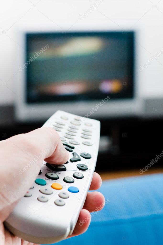 Hand with remote TV control
