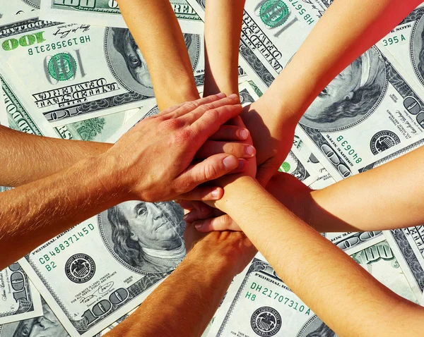 Hands on dollars — Stock Photo, Image