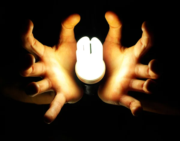 Лампа в руке — стоковое фото