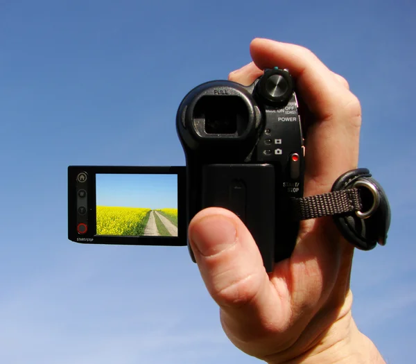 Video camera is in a hand — Stock Photo, Image