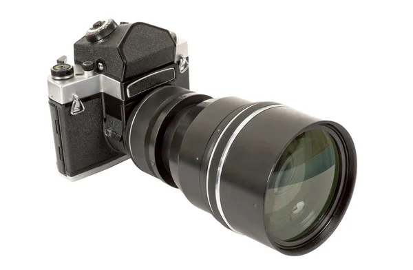 SLR камера и объектив на белой спинке — стоковое фото