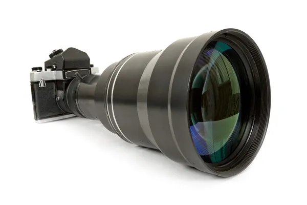 SLR камера и объектив на белой спинке — стоковое фото