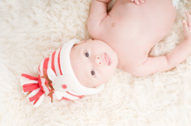 Newborn baby in chritstmas hat clipart