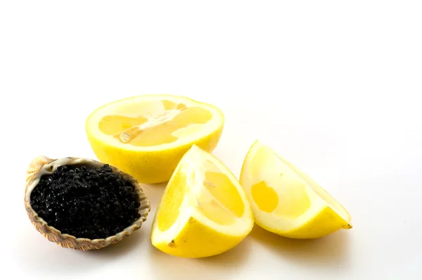 Seashell and lemon — Stock Photo, Image