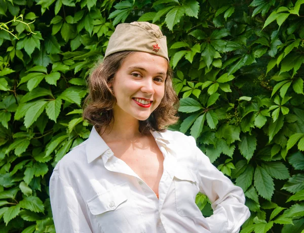 Girl wearing a soviet soldier cap — Stock Photo, Image