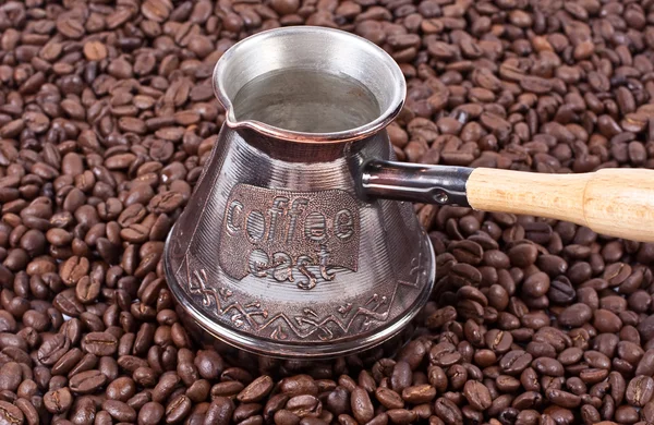 Bean coffee and turkish pot — Stock Photo, Image