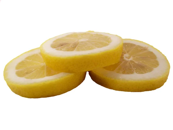 Відрізки лимона на білому фоні — стокове фото