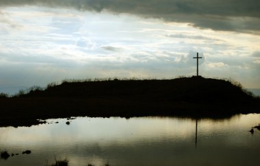 Cross on the top of the hill clipart