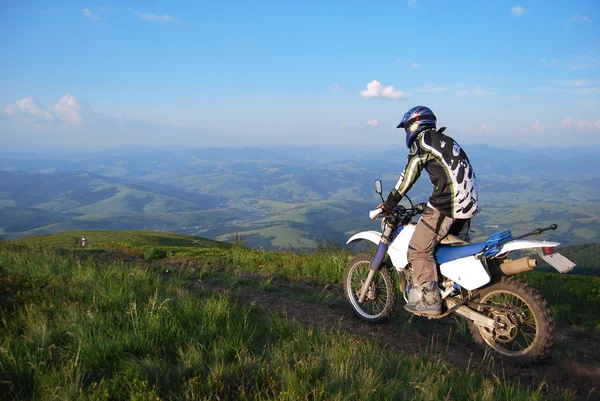 Enduro motocycle riding in highlands — Stock Photo, Image