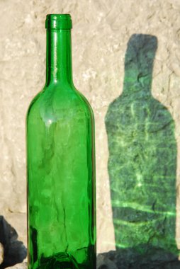 Green bottle and its reflection clipart