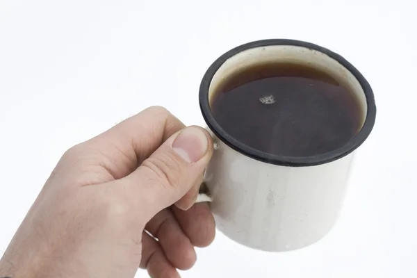 Чашка чая в руке человека — стоковое фото