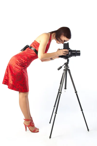 stock image Female photographer in red dress