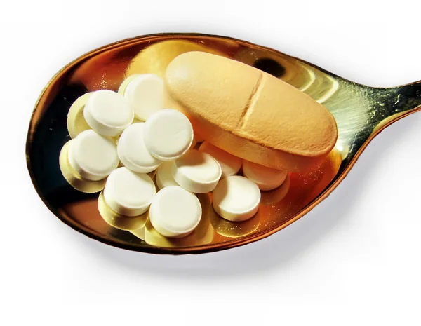 Pillen op een theelepel — Stockfoto