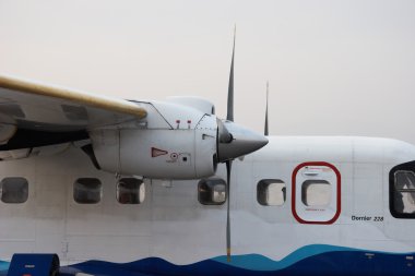 Small propeller plane waiting for departure from Kathmandu, Nepal clipart
