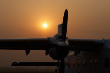 Plane at sunrise in Kathmandu airport, Nepal clipart