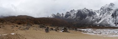 Sand 'beach' near snow mountains panorama, Himalaya, Nepal clipart