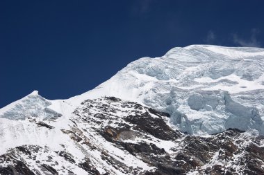 Layers of ice at Nirekha mountain summit, Himalaya, Nepal clipart