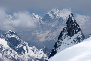 Distant snow mountains across a valley, Himalaya, Nepal clipart