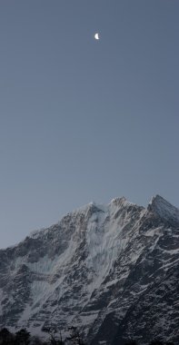 Moon over Kangtega snow mountain, Everest trek, Himalayas, Nepal clipart