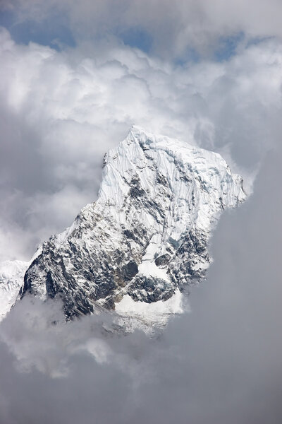 Cloud formations over Cholatse snow summit, Himalaya, Nepal