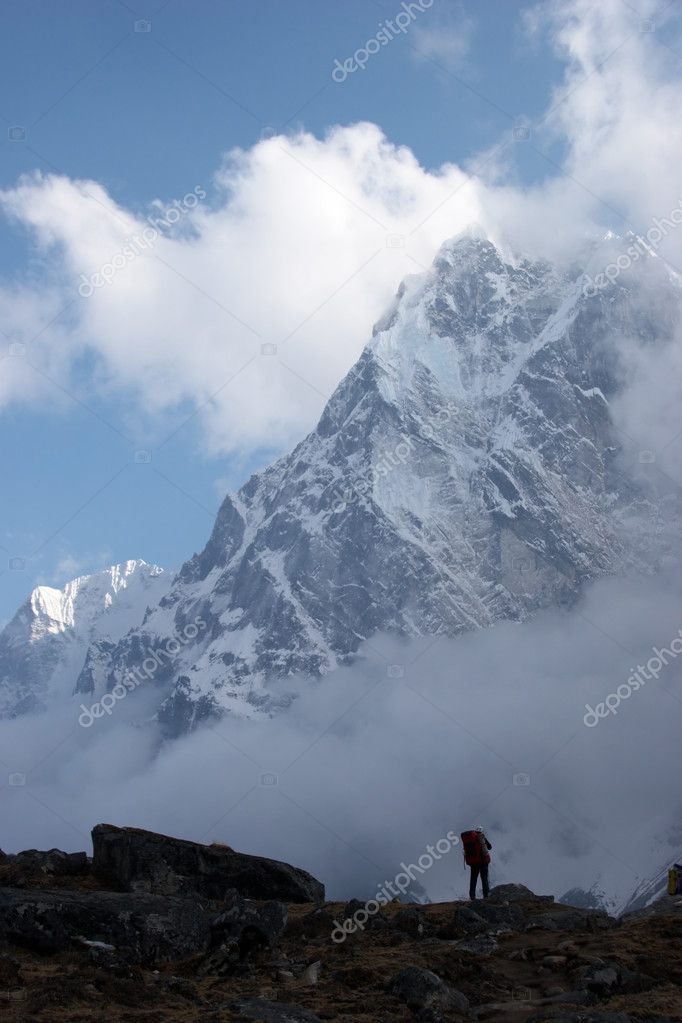 climber looking at mountain covered with | 图库照片 08