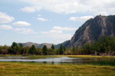 Lake on the mountains background clipart