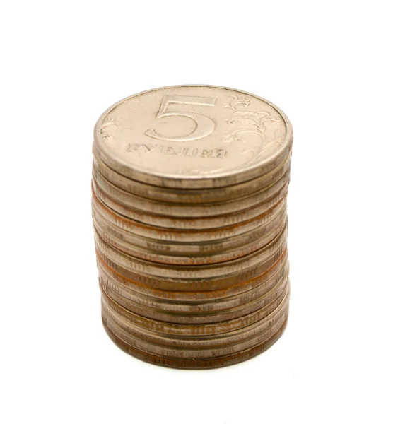 Montón de monedas sobre un fondo blanco. —  Fotos de Stock