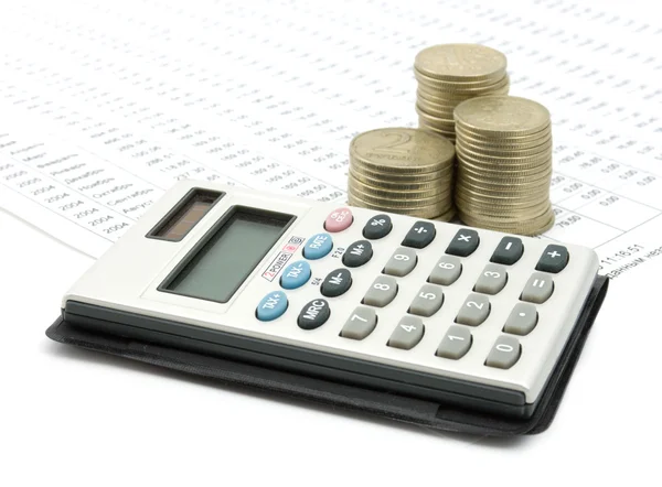 Calculator and coins on diagram — Stock Photo, Image