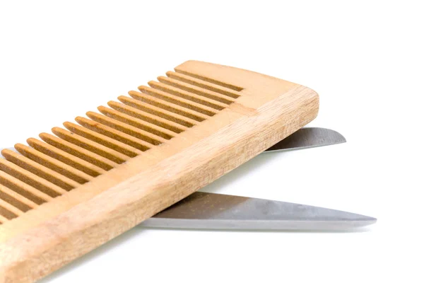Wooden hairbrush and scissors — Stock Photo, Image