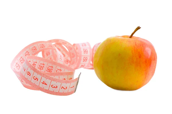 Nastro di misurazione rosa e mela Fotografia Stock