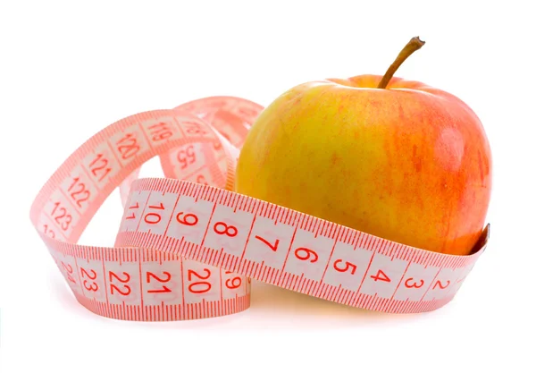 Pink ölçüm bandı ve elma — Stok fotoğraf