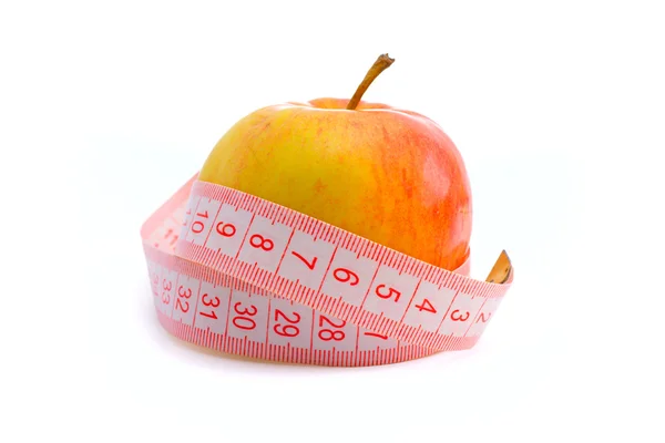 Pink ölçüm bandı ve elma — Stok fotoğraf